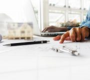 Hands of Engineer working on blueprint,Construction concept. Engineering tools.Vintage tone retro filter effect,soft focus(selective focus)